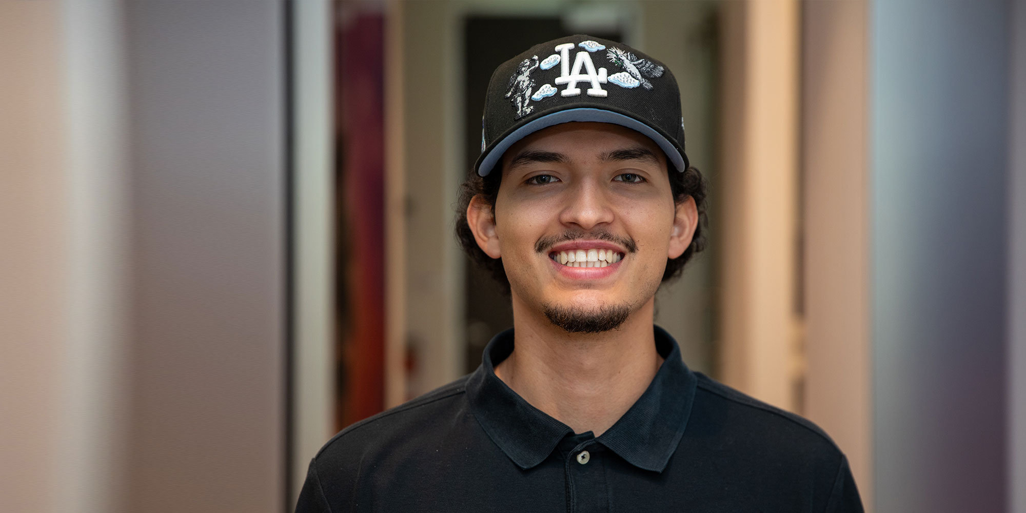 headshot of patient smiling brightly after their dental procedure