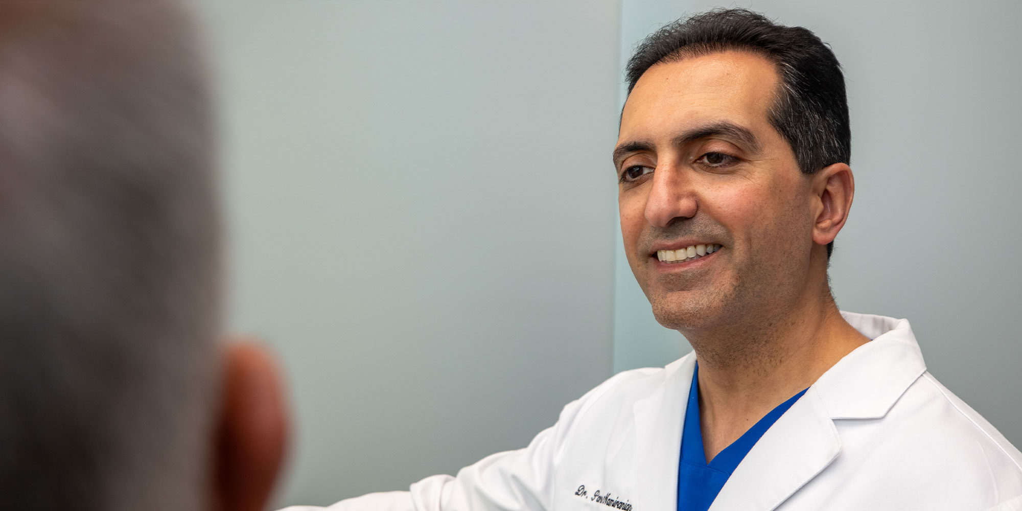 doctor going over dental procedure information with patient