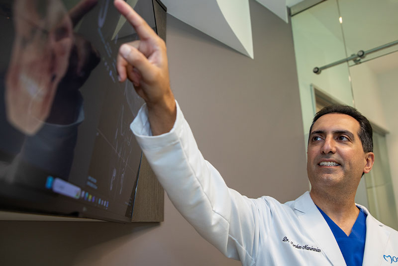 doctor going over dental procedure information with patient