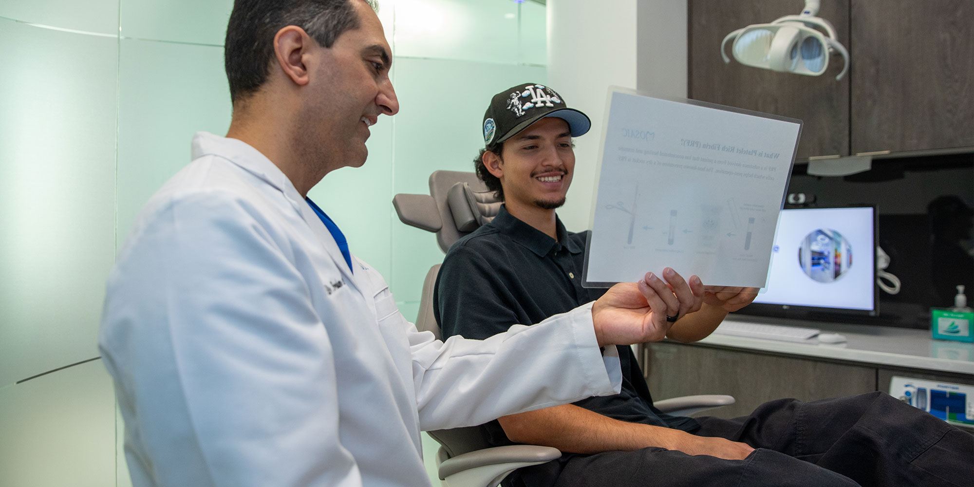 doctor and patient going over dental procedure information
