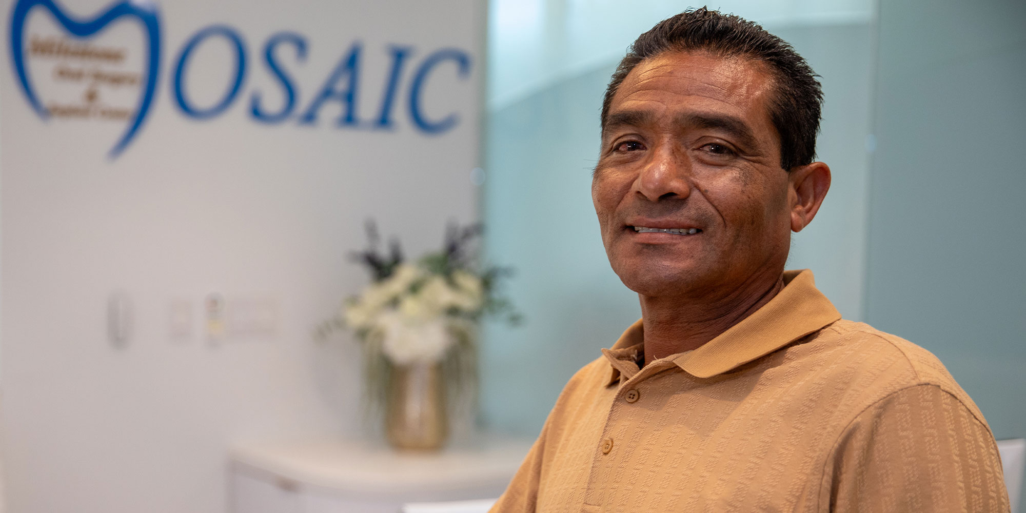 headshot of patient smiling brightly