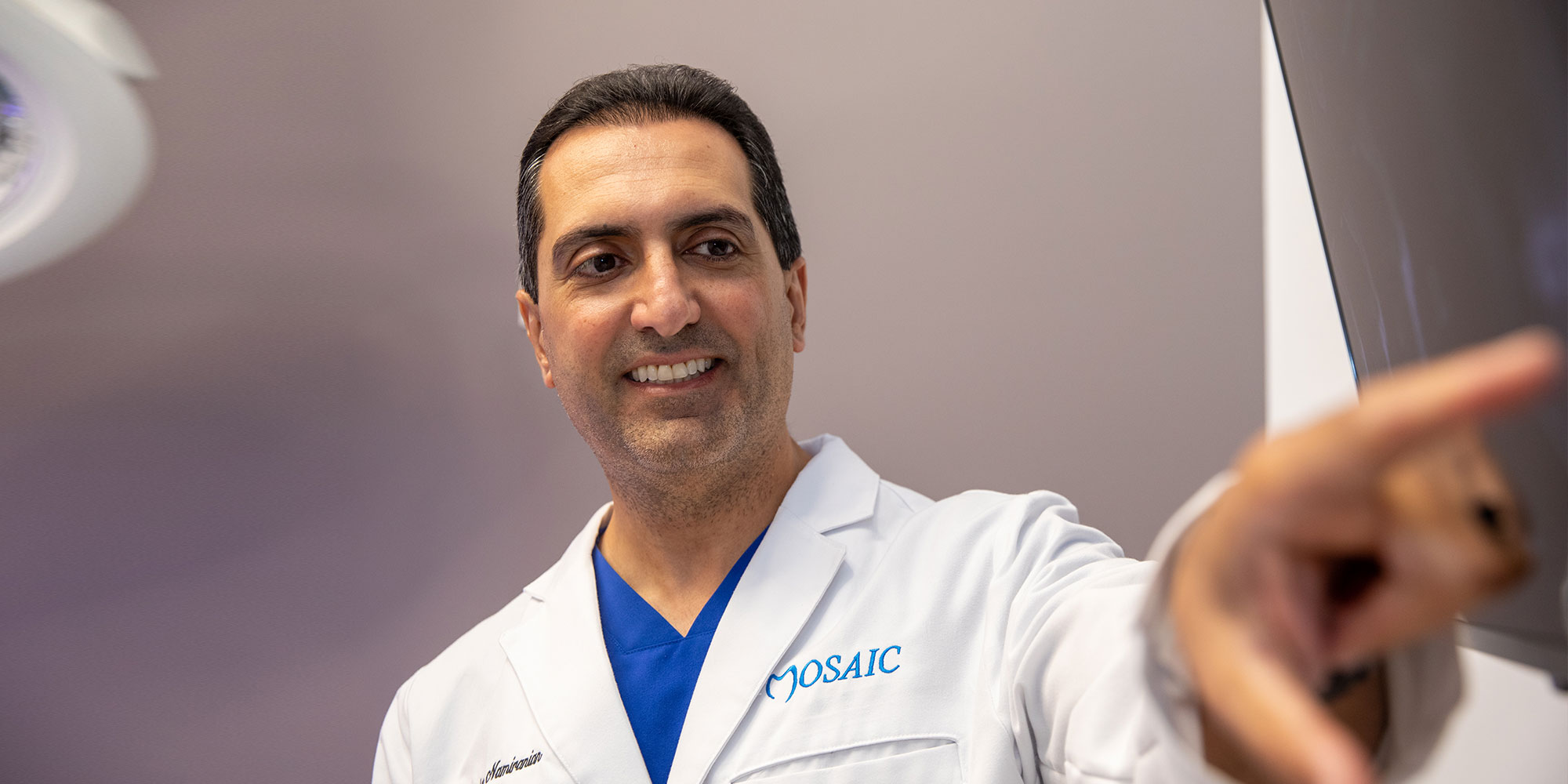 doctor going over dental procedure information with dental patient within the dental center
