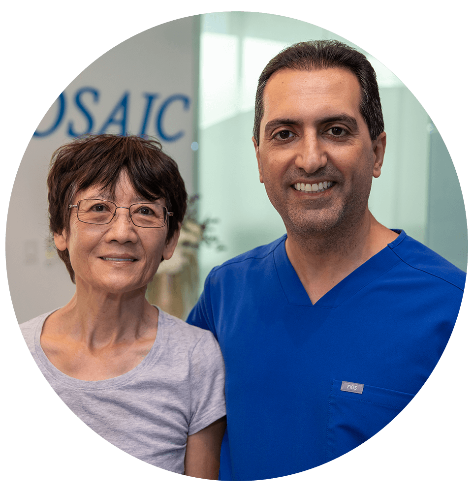 dental patient and doctor both smiling brightly after dental patient procedure