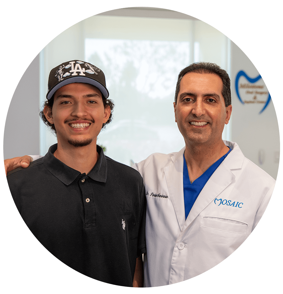 dental patient and doctor both smiling brightly after dental patient procedure