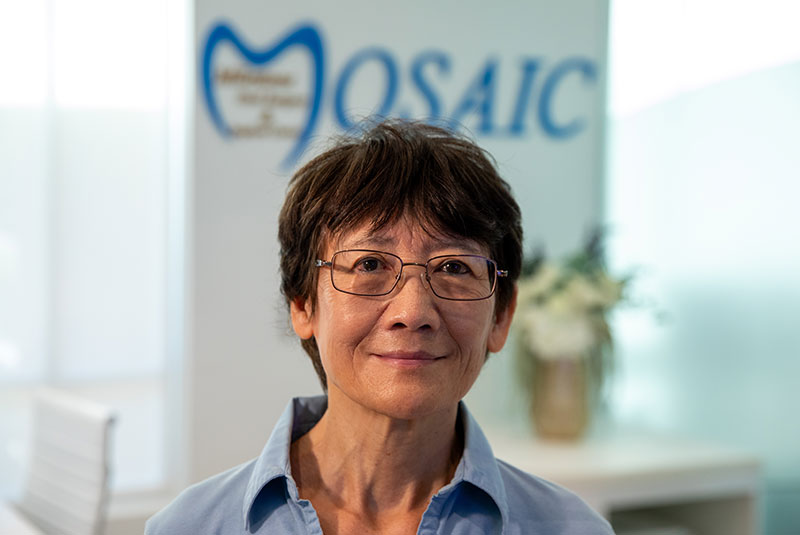 Headshot of dental patient smiling brightly